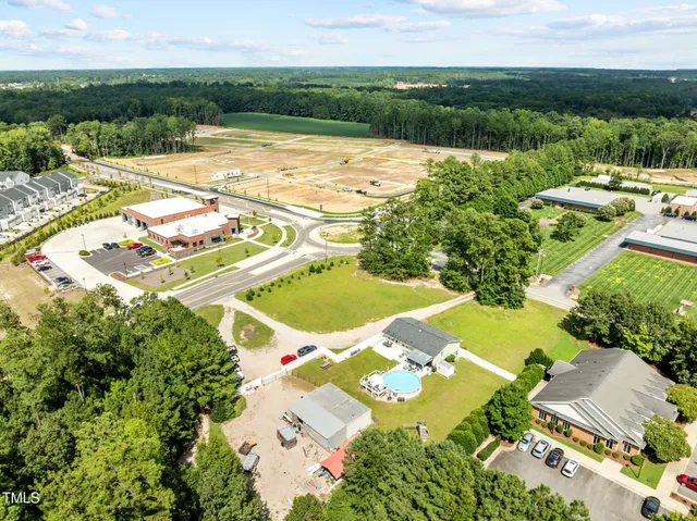 a view of a yard with an outdoor seating
