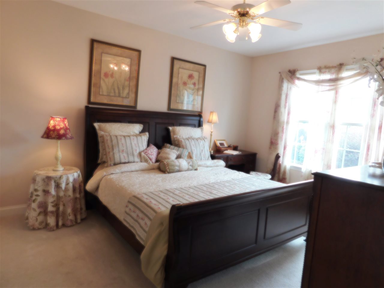 52 Hunters Trail Waynesboro, VA 22980 - Photo 15 of 32 a bedroom with a bed and a chandelier