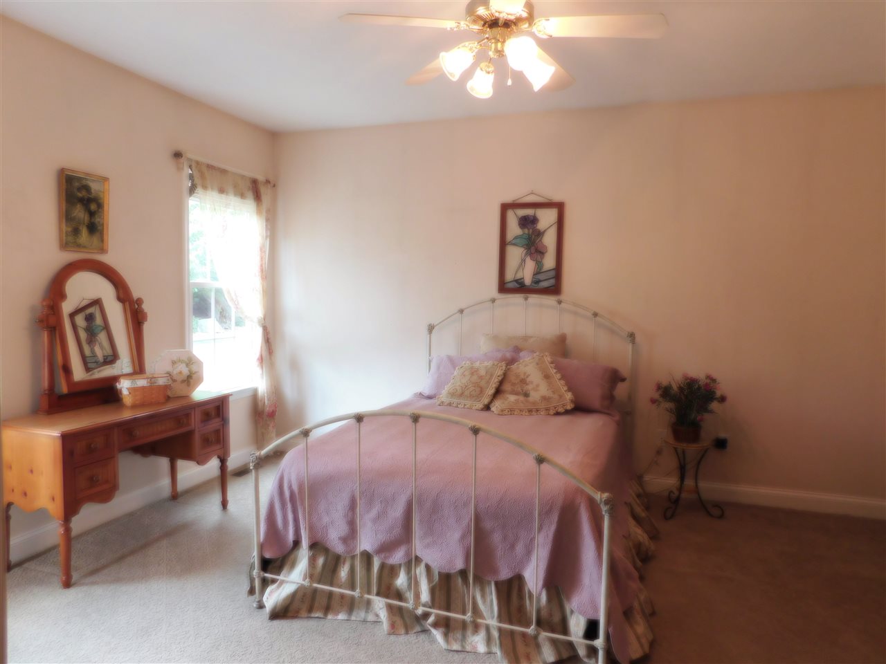 52 Hunters Trail Waynesboro, VA 22980 - Photo 20 of 32 a bedroom with a bed and a chandelier
