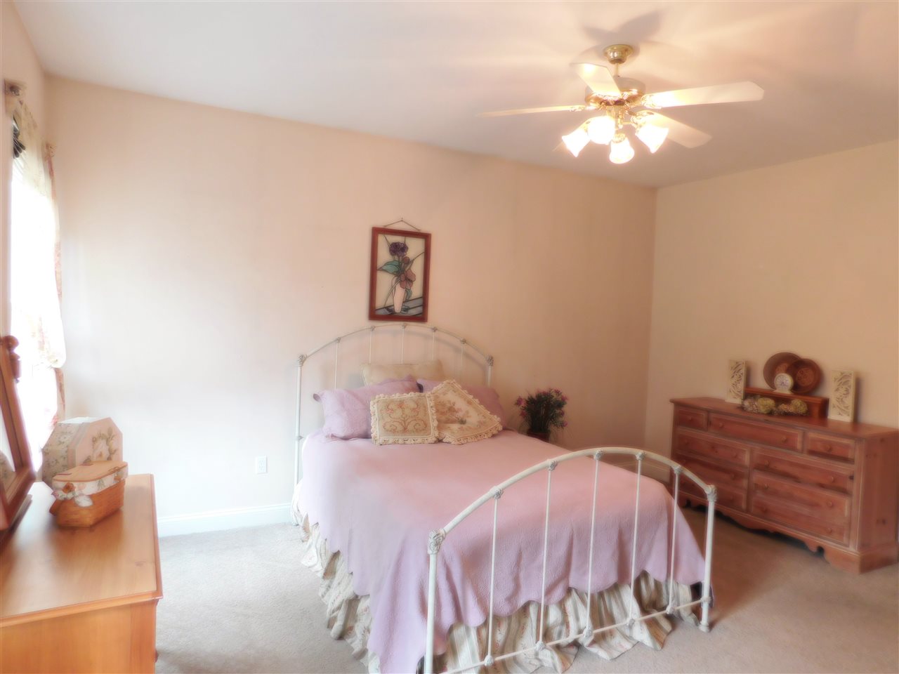 52 Hunters Trail Waynesboro, VA 22980 - Photo 21 of 32 a bedroom with a bed and a chandelier