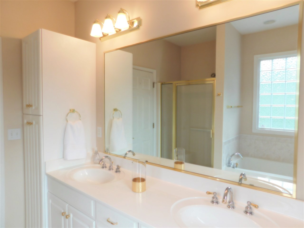 52 Hunters Trail Waynesboro, VA 22980 - Photo 24 of 32 a bathroom with a sink tub and a mirror