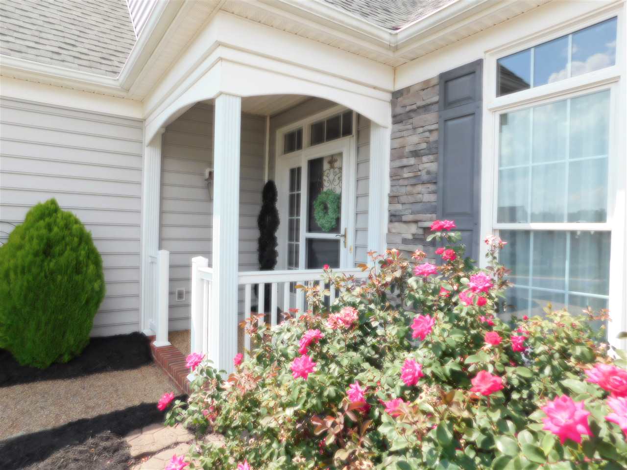 52 Hunters Trail Waynesboro, VA 22980 - Photo 5 of 32 a view of a potted plant sitting in front of a house