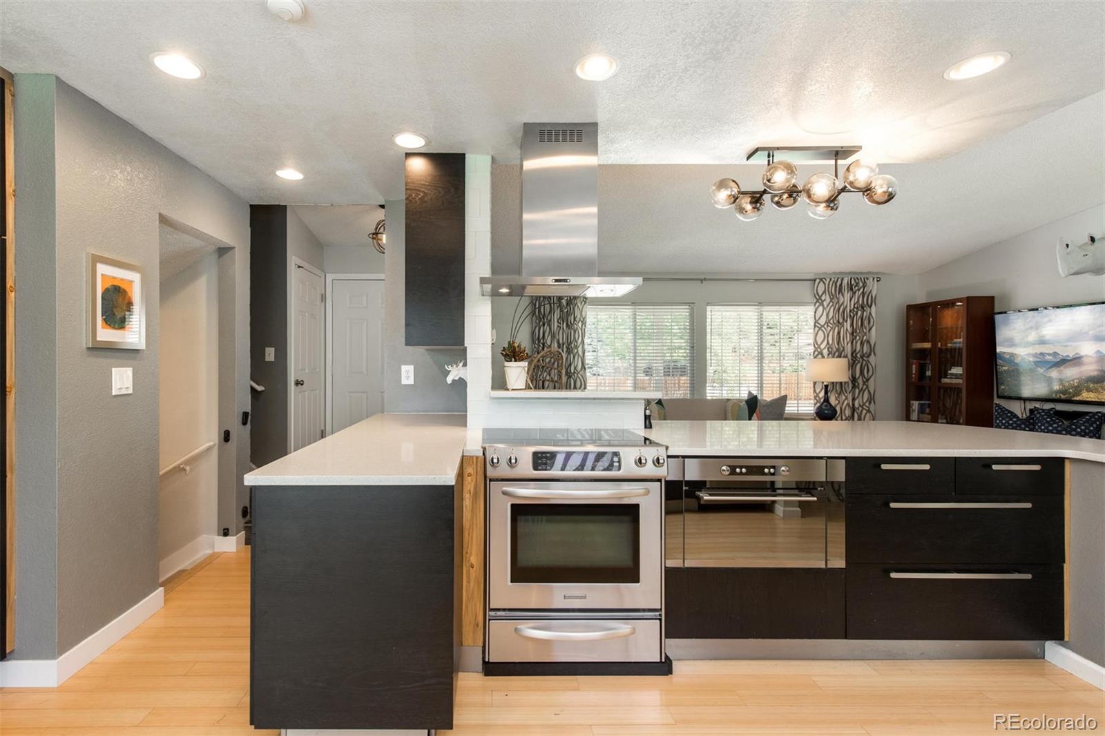 100 Prairie Ridge Road Highlands Ranch, CO 80126 - Photo 11 of 34 a kitchen with a stove and a refrigerator