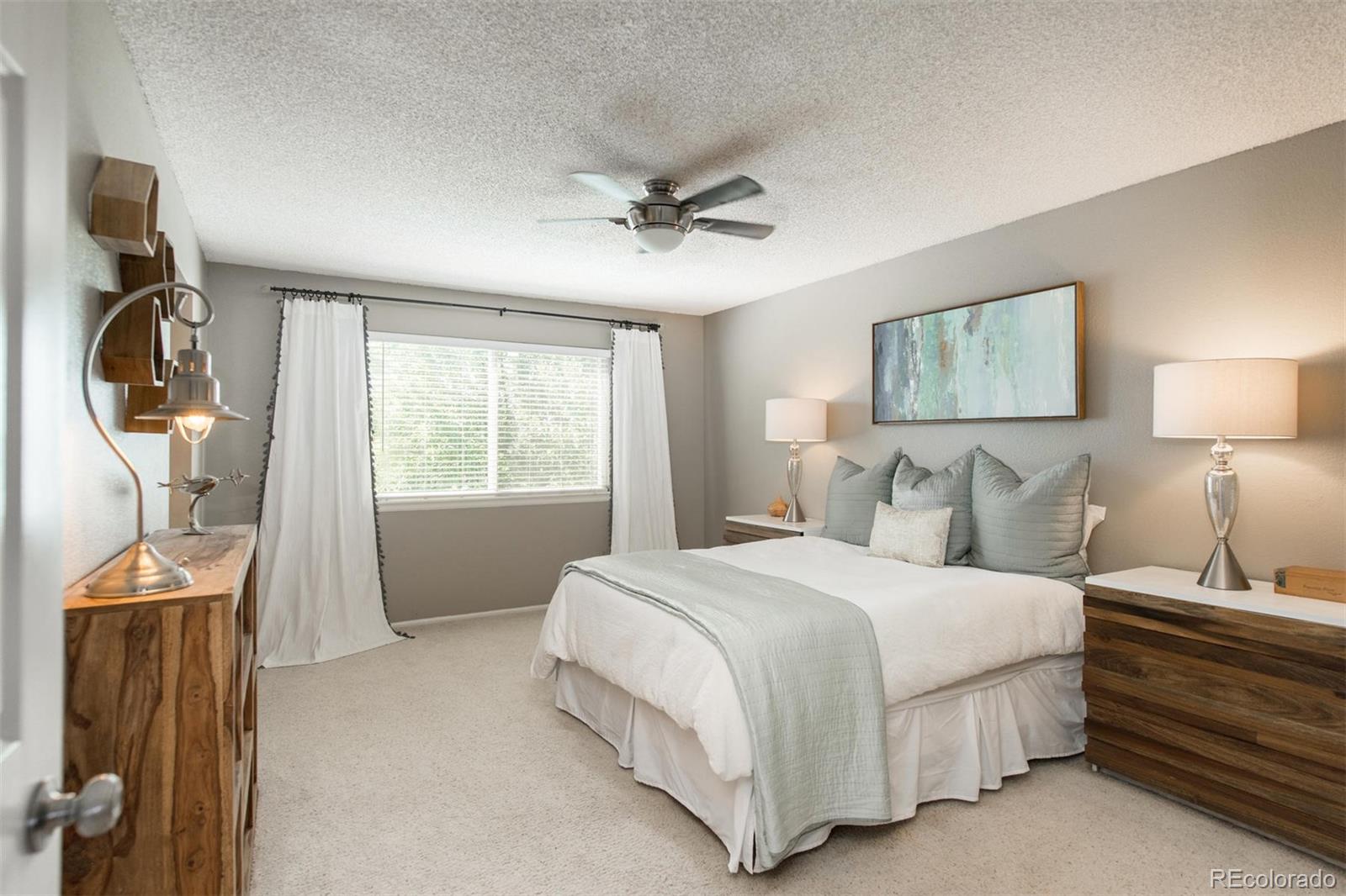 100 Prairie Ridge Road Highlands Ranch, CO 80126 - Photo 19 of 34 a bedroom with a bed and a window