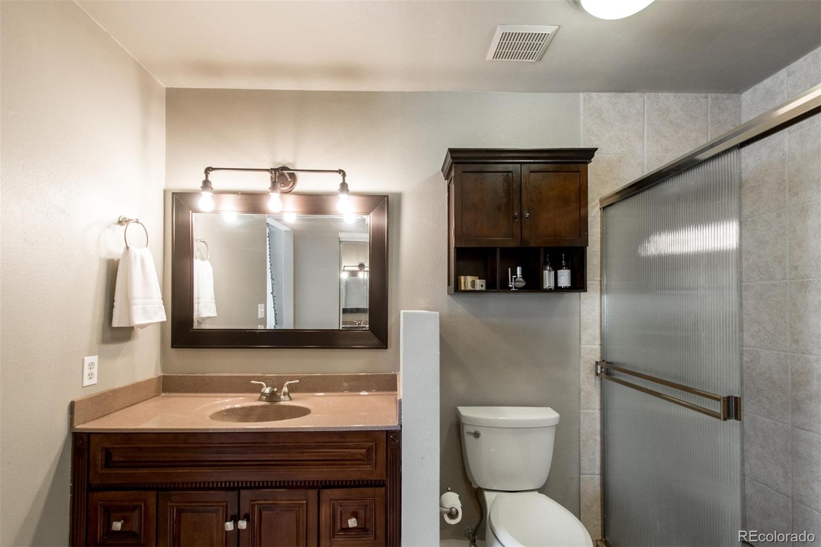 100 Prairie Ridge Road Highlands Ranch, CO 80126 - Photo 21 of 34 a bathroom with a sink and a mirror