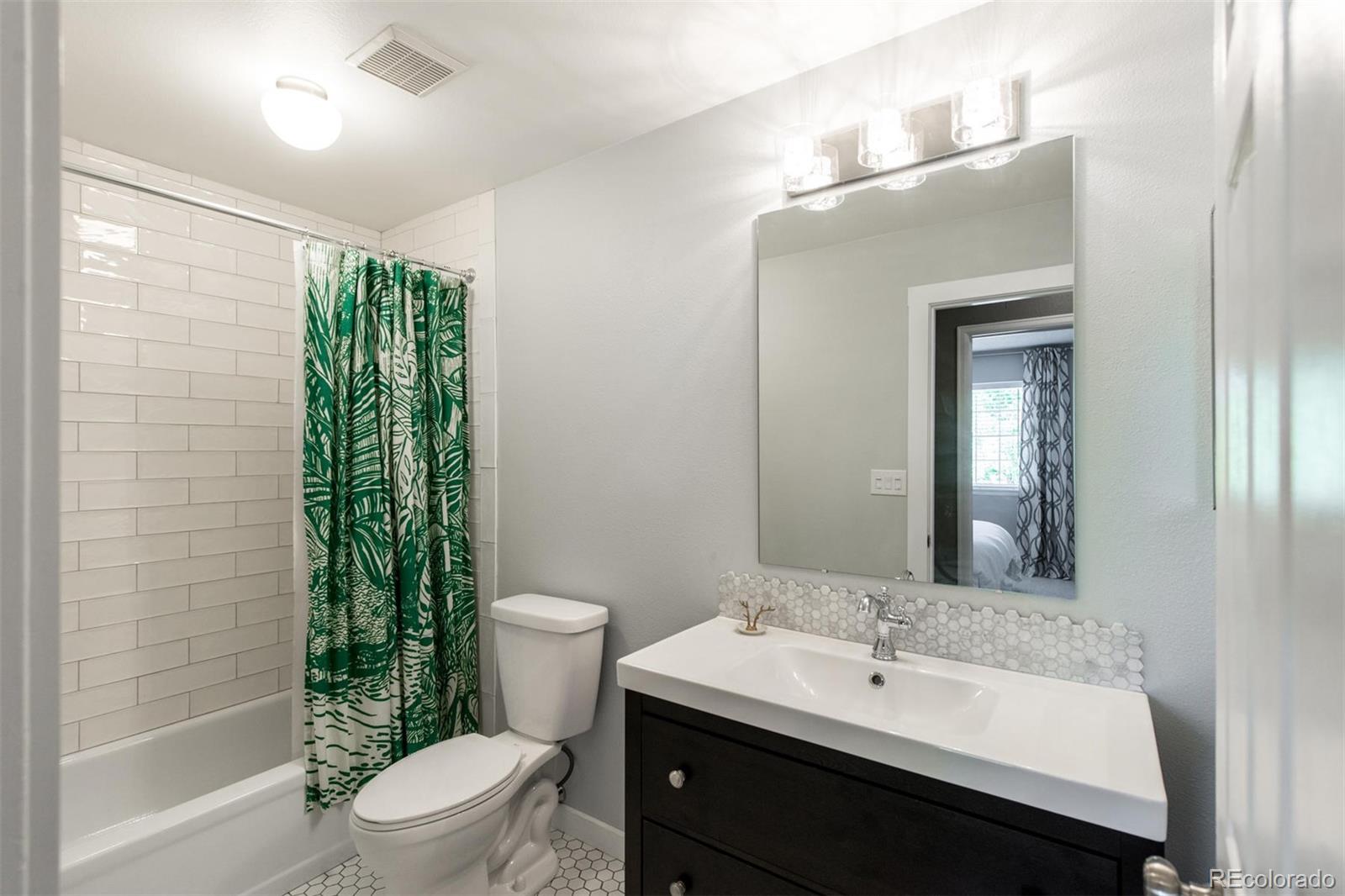 100 Prairie Ridge Road Highlands Ranch, CO 80126 - Photo 24 of 34 a bathroom with a sink a toilet and shower