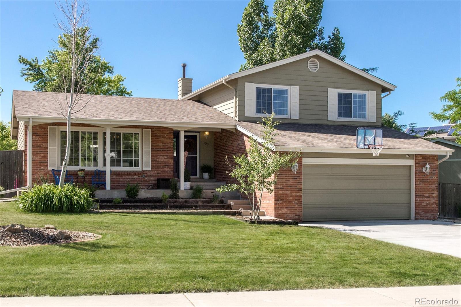 100 Prairie Ridge Road Highlands Ranch, CO 80126 - Photo 25 of 34 a front view of a house with a yard