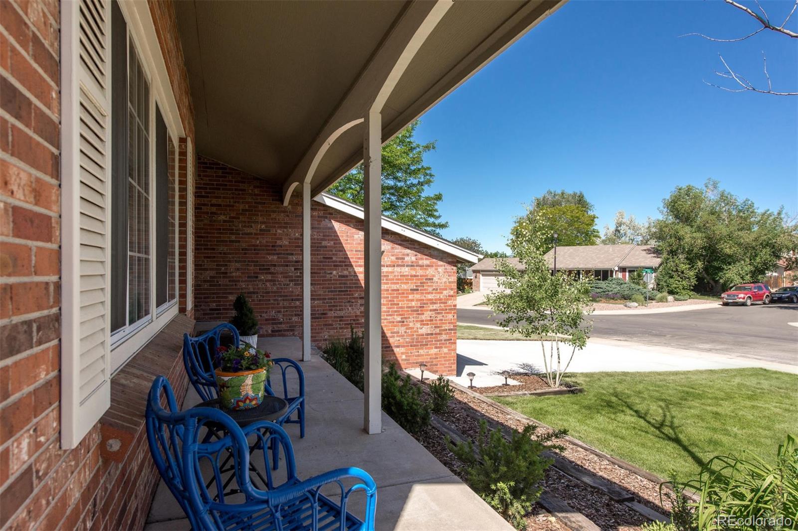 100 Prairie Ridge Road Highlands Ranch, CO 80126 - Photo 26 of 34 a view of a patio with table and chairs and potted plants