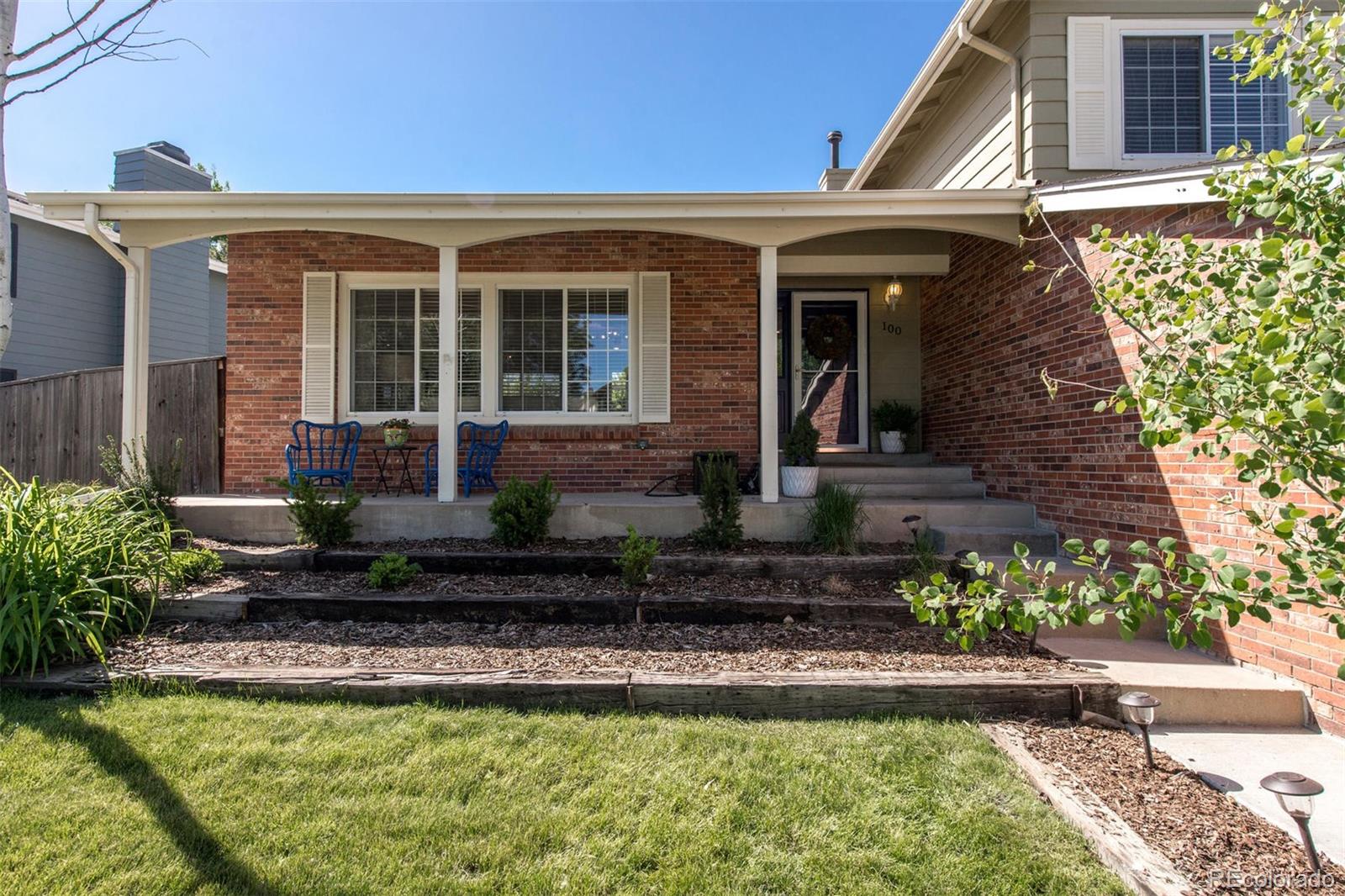 100 Prairie Ridge Road Highlands Ranch, CO 80126 - Photo 27 of 34 a front view of a house with a yard