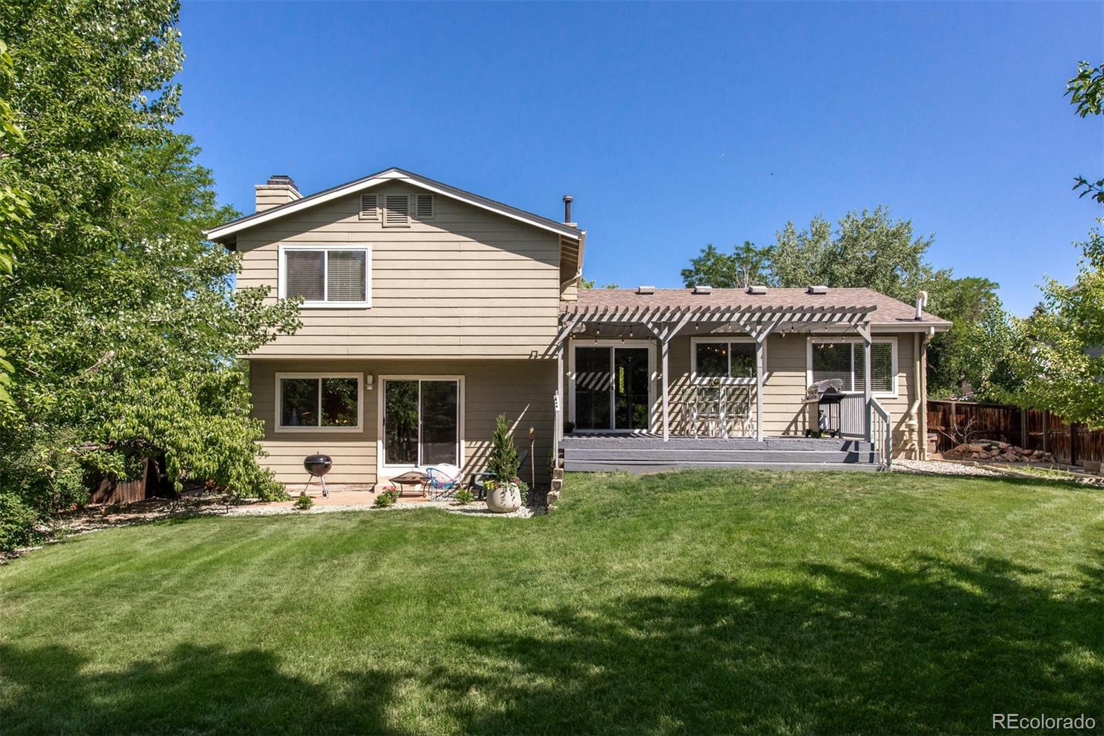 100 Prairie Ridge Road Highlands Ranch, CO 80126 - Photo 28 of 34 a view of a house with a yard