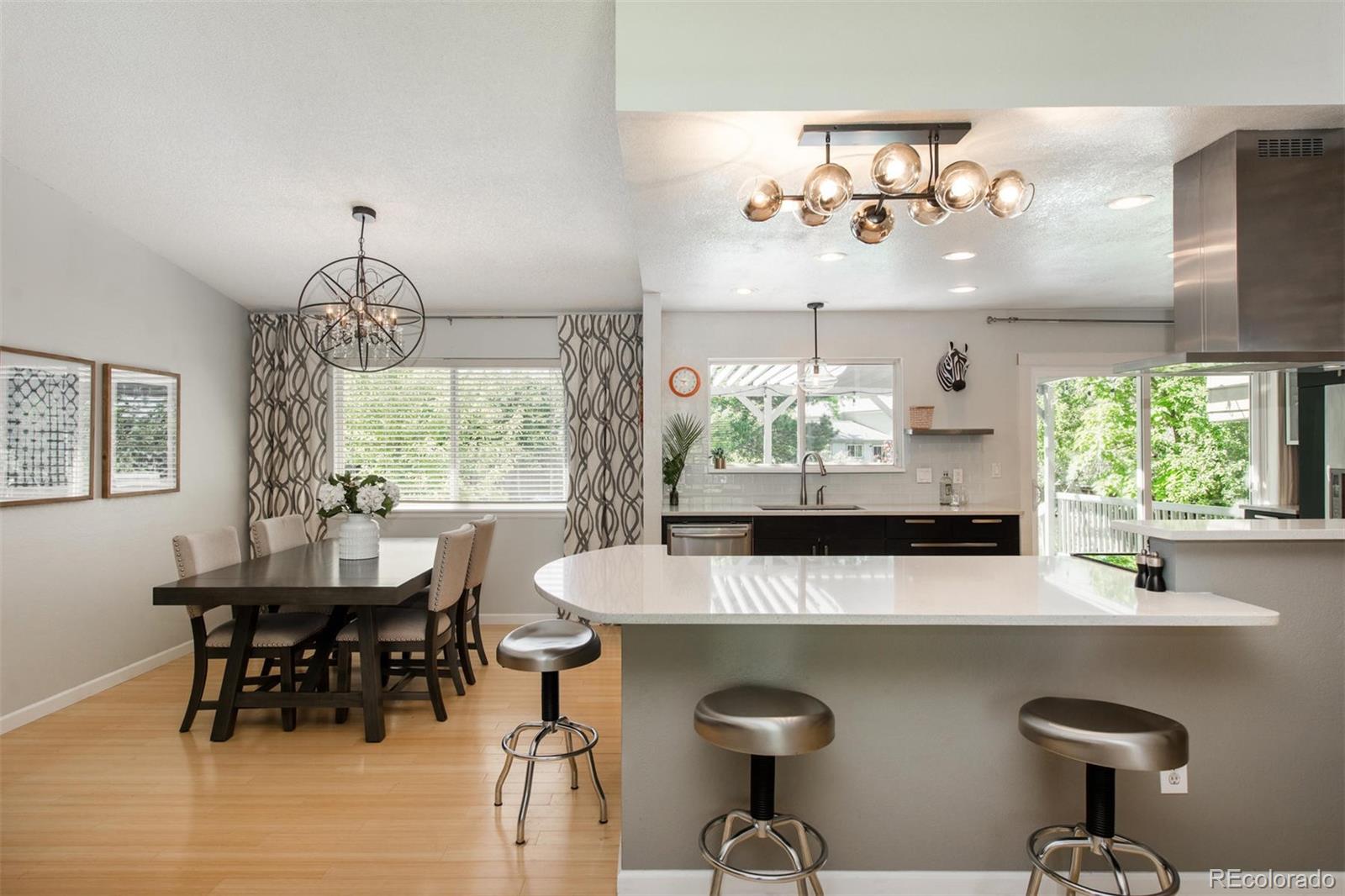 100 Prairie Ridge Road Highlands Ranch, CO 80126 - Photo 5 of 34 a kitchen with a table and chairs in it