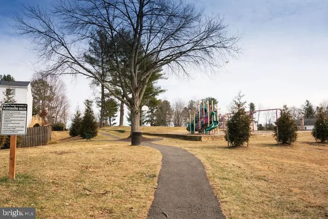 a view of a dinning table and chairs in the balcony