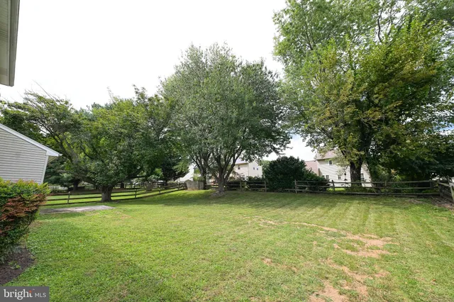 a view of a swimming pool with an outdoor space and seating area