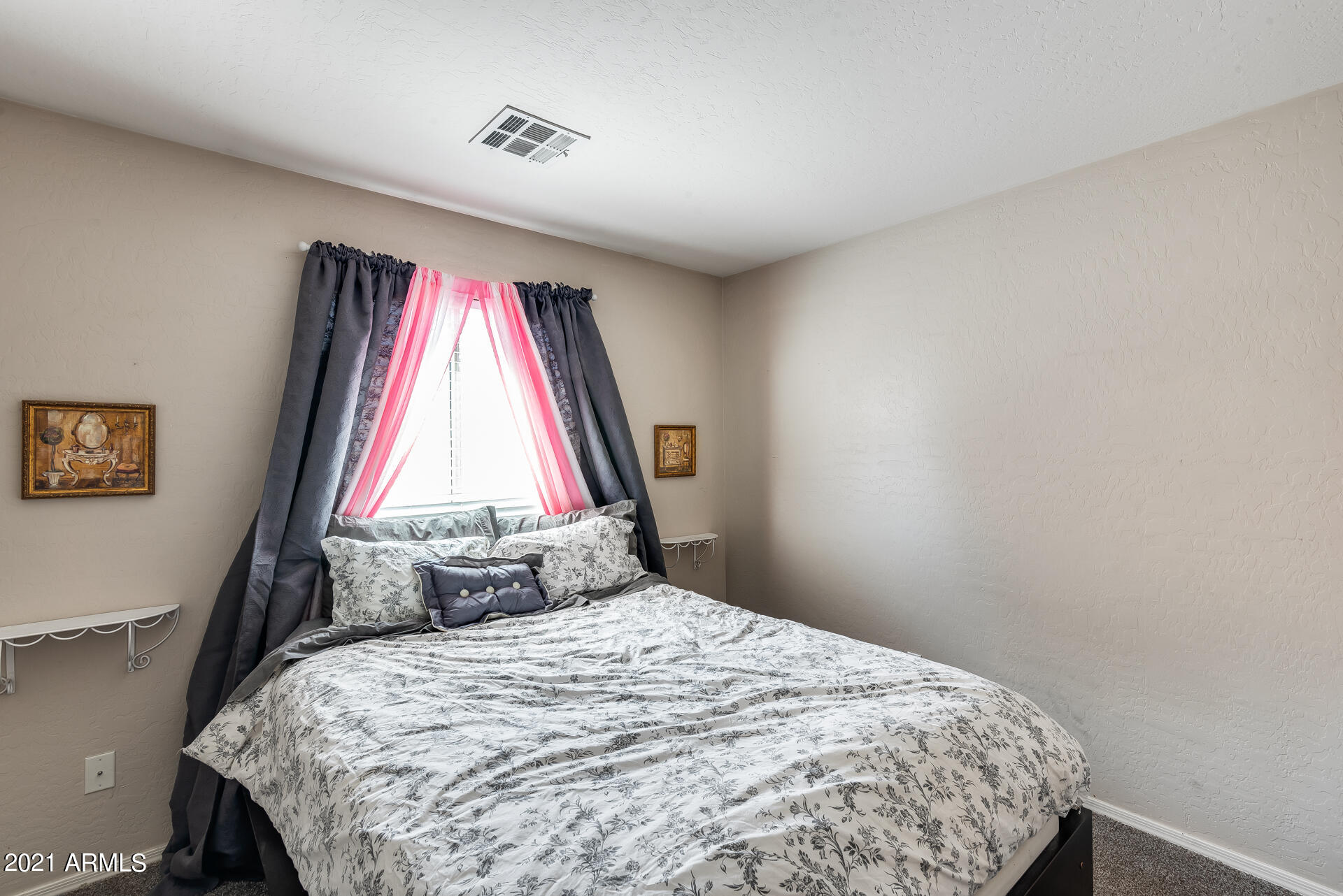 15037 West Calavar Road Surprise, AZ 85379 - Photo 14 of 28 a bedroom with a bed and a window