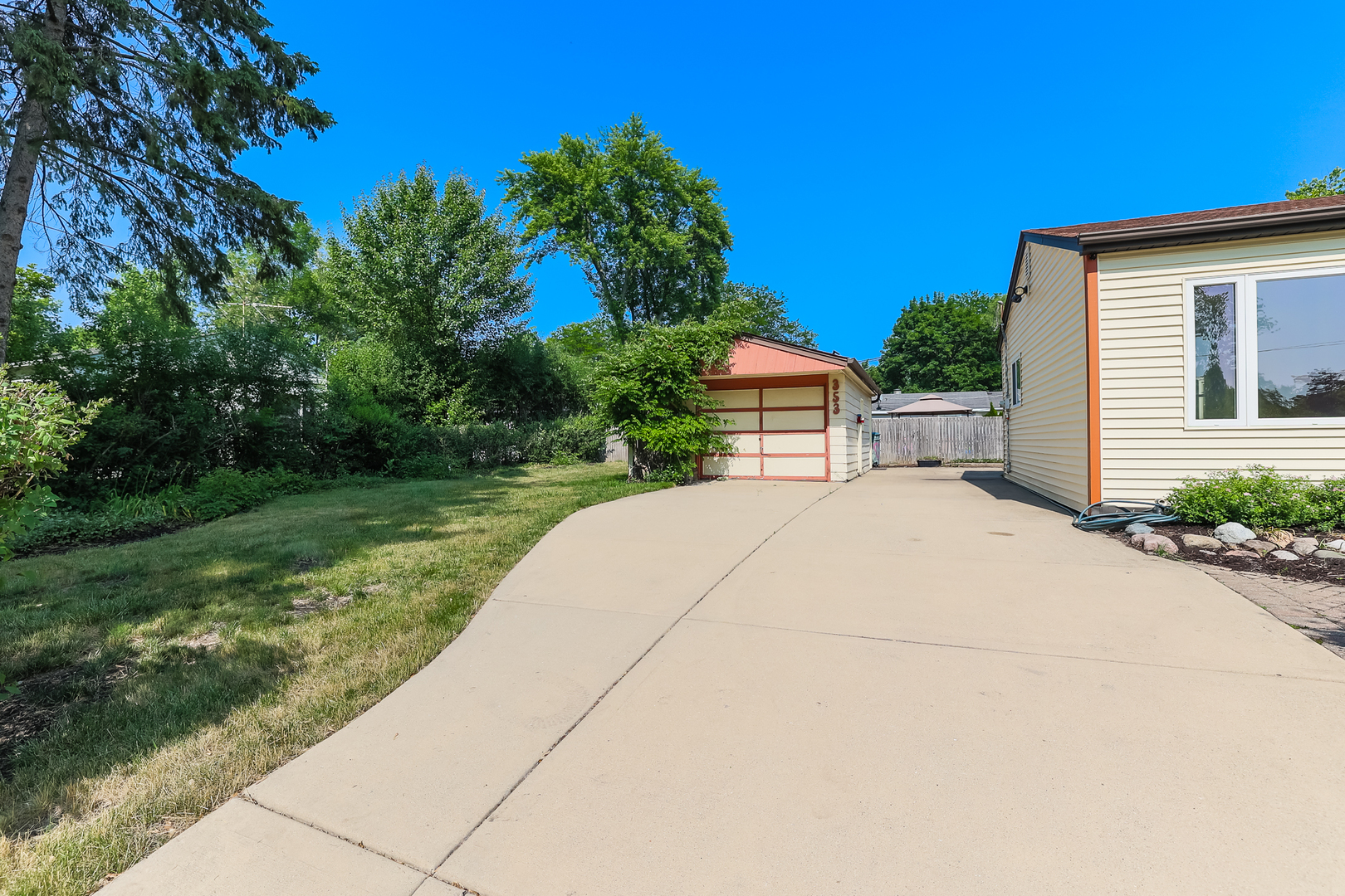 353 Raupp Boulevard Buffalo Grove, IL 60089 - Photo 2 of 28 a house view with a garden space