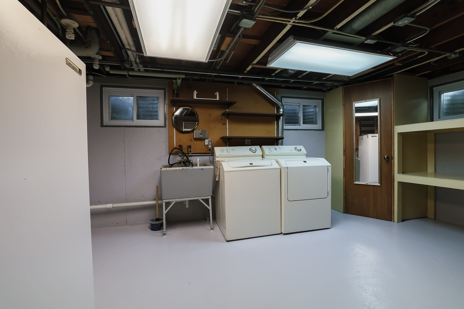 353 Raupp Boulevard Buffalo Grove, IL 60089 - Photo 24 of 28 a utility room with dryer and washer