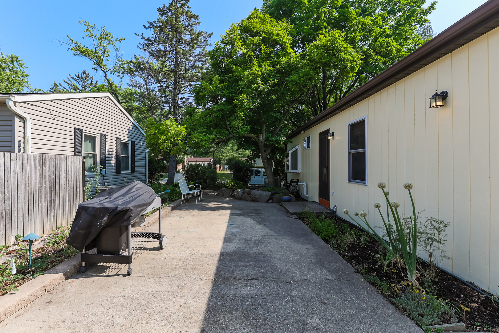 353 Raupp Boulevard Buffalo Grove, IL 60089 - Photo 27 of 28 a view of backyard with chair and potted plants
