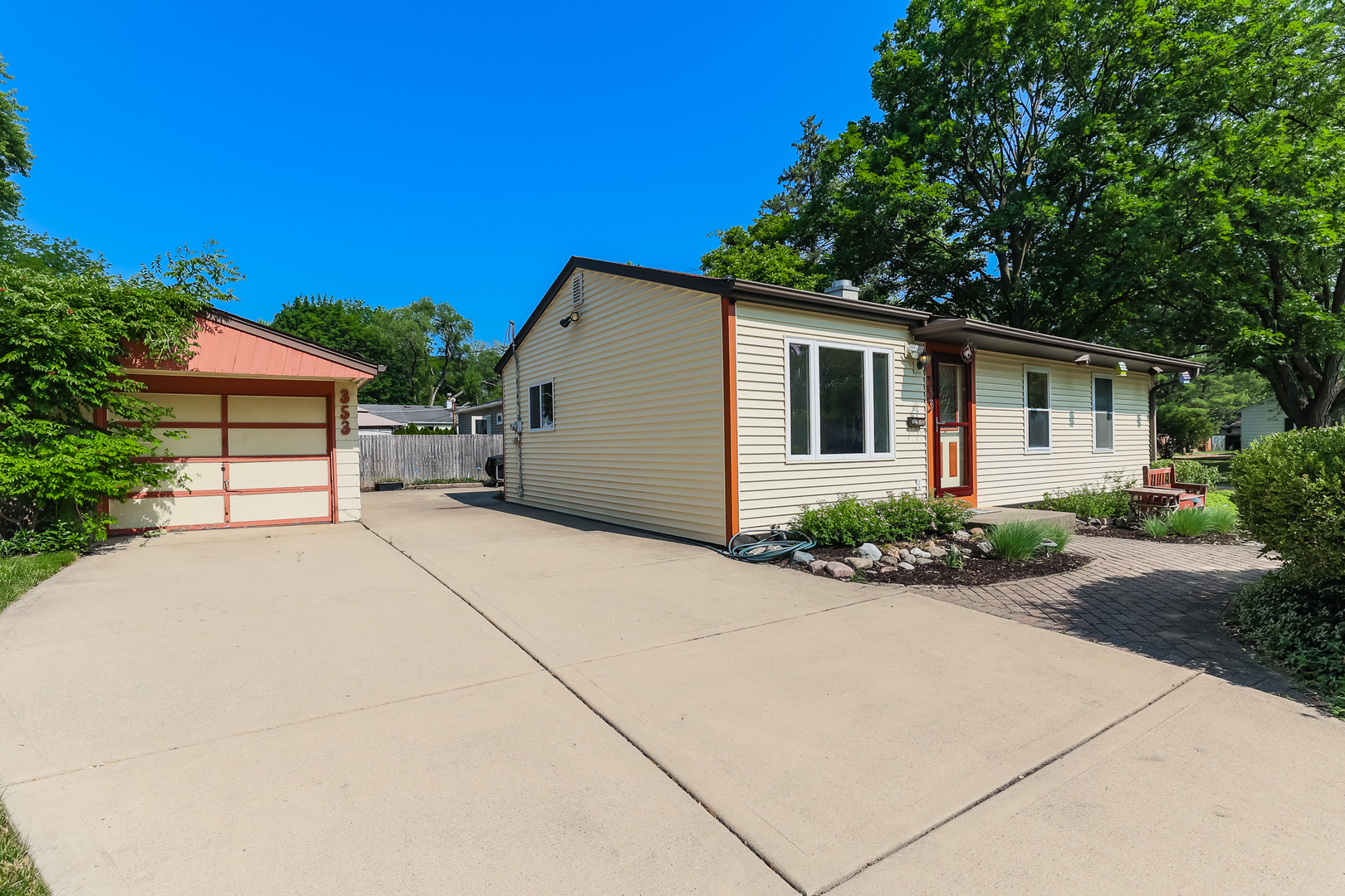 353 Raupp Boulevard Buffalo Grove, IL 60089 - Photo 5 of 28 front view of a house with a yard