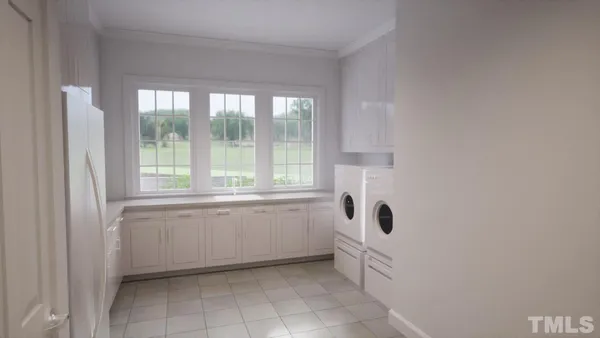 a bathroom with a granite countertop sink and a window