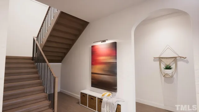 a view of entryway and hall with wooden floor