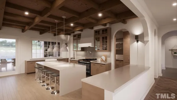 a kitchen with stainless steel appliances granite countertop a sink a stove and a refrigerator