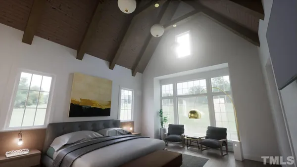 a bedroom with furniture and a large window