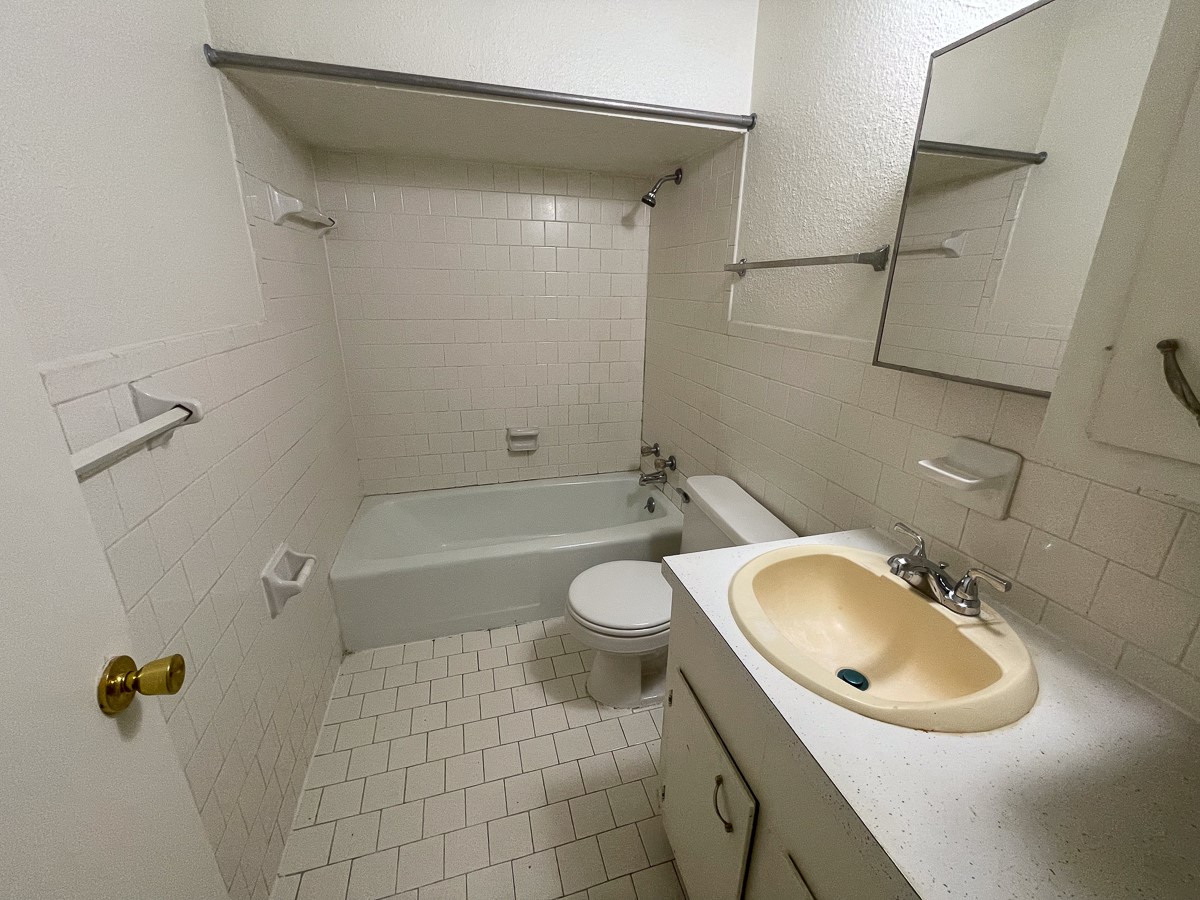 704 Cline Street Huntsville, TX 77340 - Photo 11 of 21 a bathroom with a sink toilet and shower