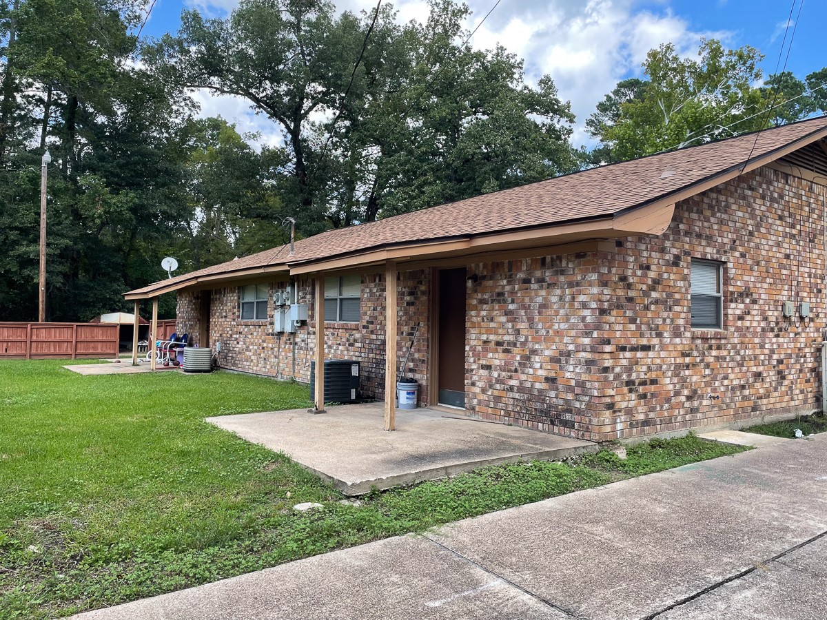 704 Cline Street Huntsville, TX 77340 - Photo 18 of 21 a view of a house with a garden