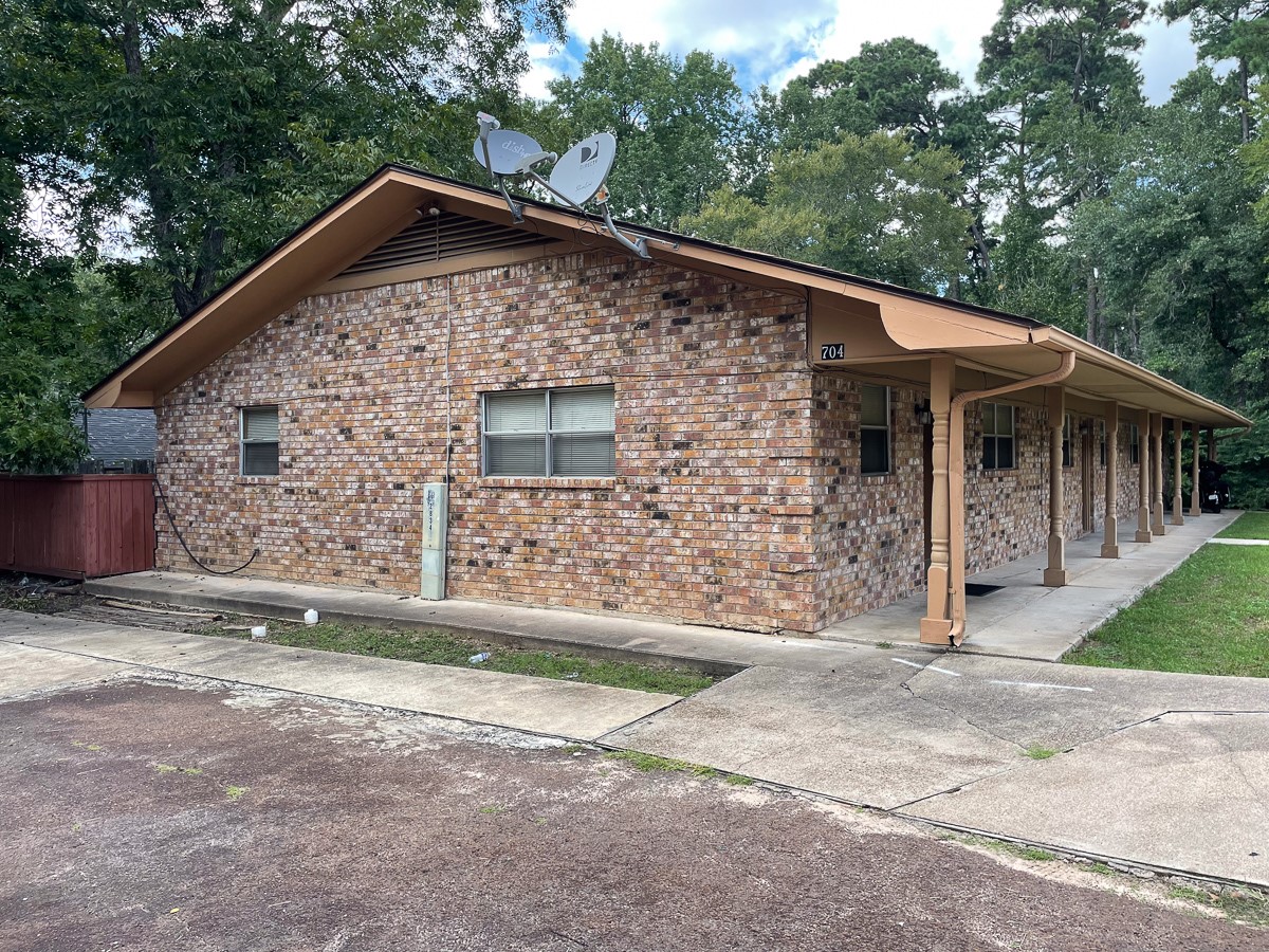 704 Cline Street Huntsville, TX 77340 - Photo 19 of 21 a front view of a house with garage