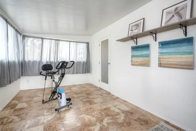 a view of a livingroom with furniture and windows