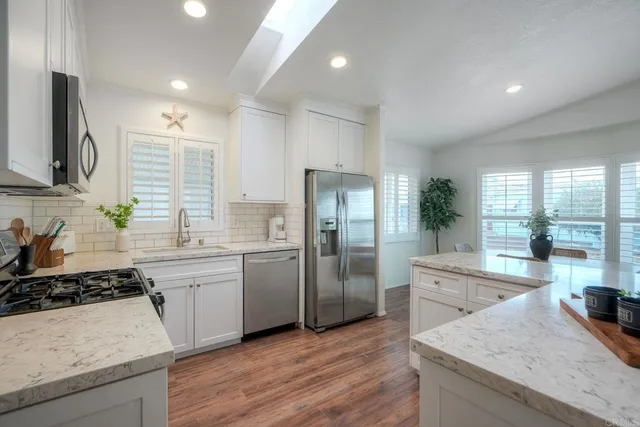 a kitchen with a sink stove and refrigerator
