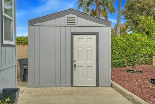 an outdoor space with seating area and garden view