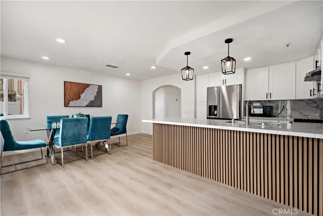a view of a kitchen with electric appliances
