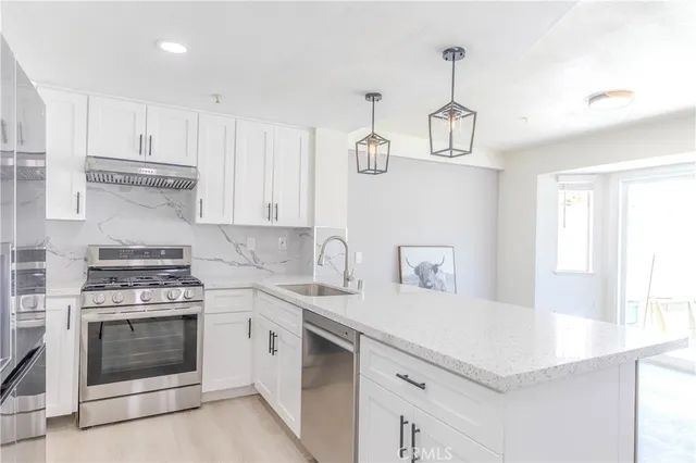 a view of a livingroom with furniture and staircase