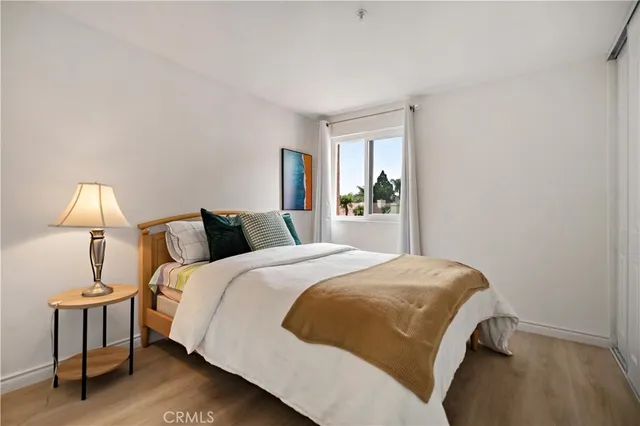 a bed room with a bed and a night stand