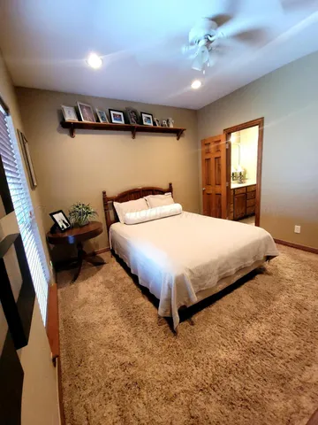 a bed room with furniture and a window