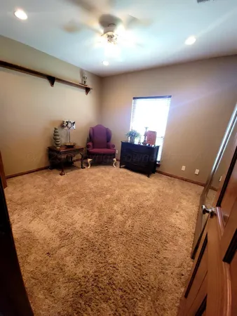 a bed room with furniture and a window