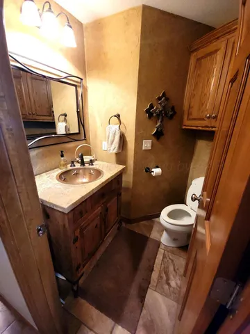 a kitchen with stainless steel appliances kitchen island granite countertop a stove a sink and a microwave