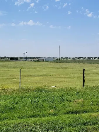 a view of a lake with a big yard