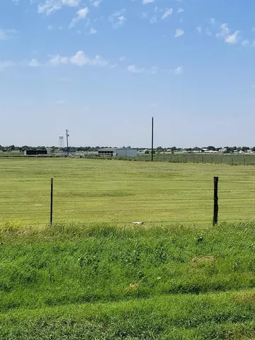 a view of a lake with a big yard