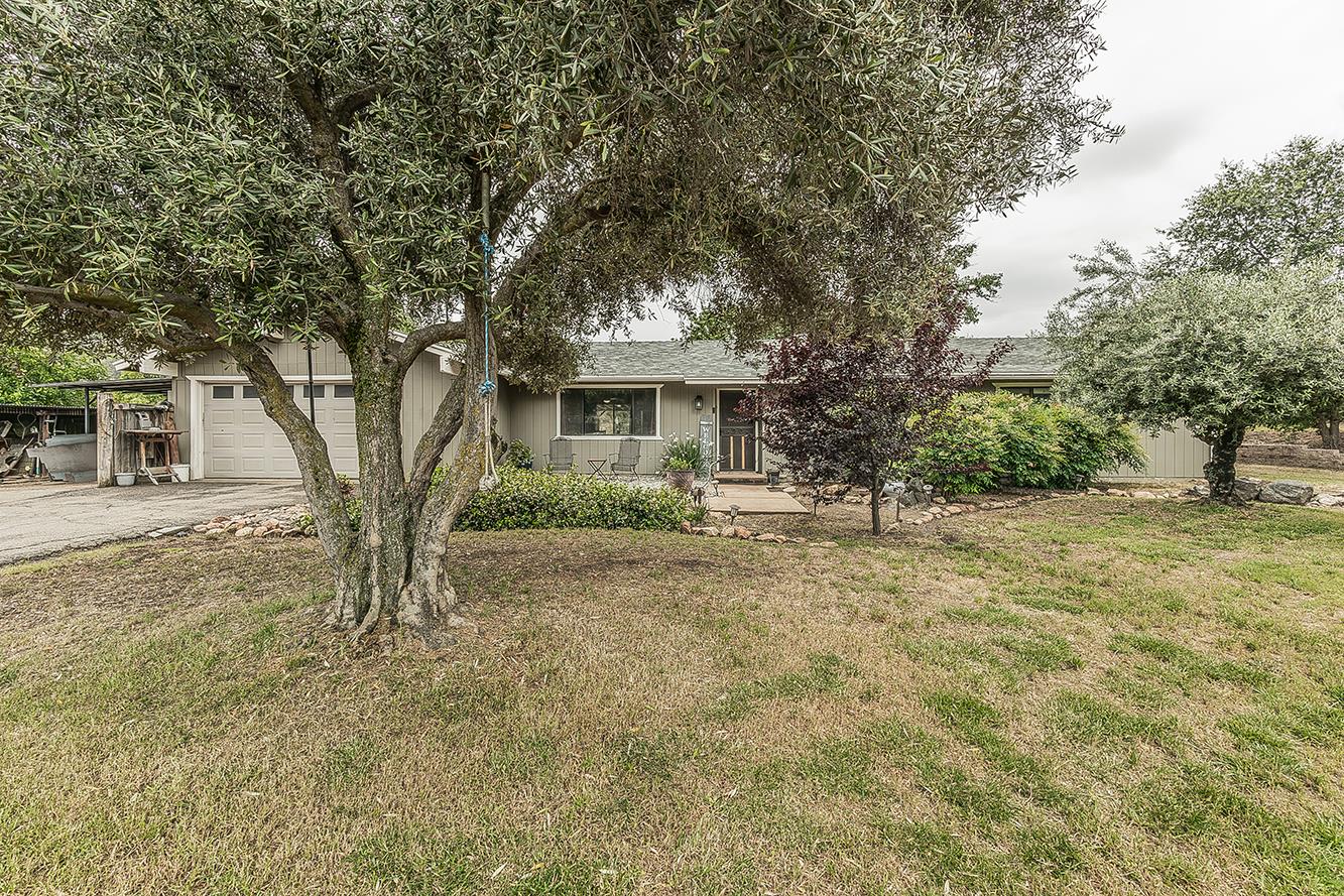 29545 Oak Meadow Road Tollhouse, CA 93667 - Photo 1 of 69 a front view of a house with a yard
