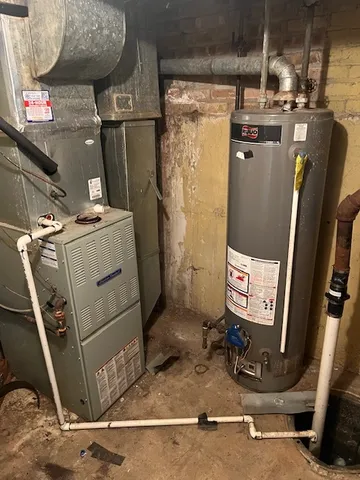a room with water heater and storage