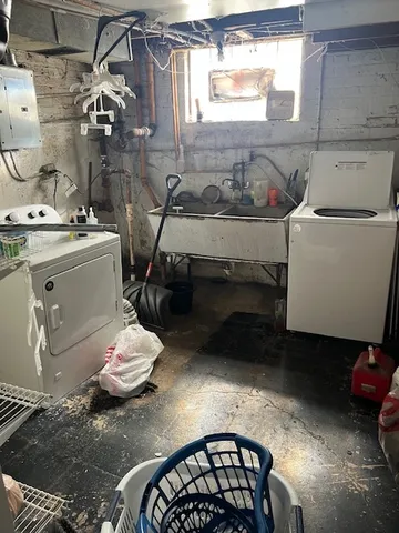 a bathroom with a sink toilet and window