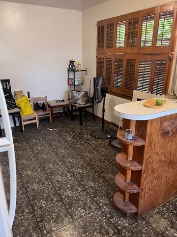 a view of a backyard with table and chairs