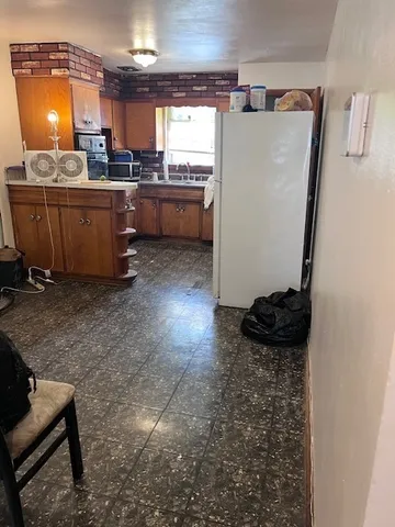 a room with cabinets and couches chair