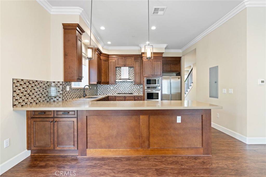 1019 Holly Avenue, Unit A Arcadia, CA 91007 - Photo 17 of 40 a large kitchen with granite countertop a large counter space a sink stainless steel appliances and cabinets