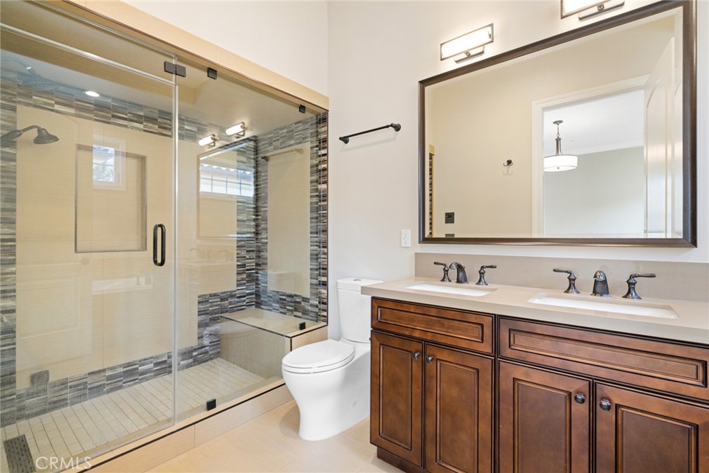 1019 Holly Avenue, Unit A Arcadia, CA 91007 - Photo 27 of 40 a bathroom with a sink a toilet and shower