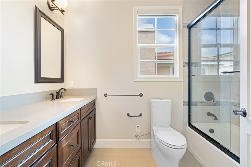 1019 Holly Avenue, Unit A Arcadia, CA 91007 - Photo 31 of 40 a bathroom with a granite countertop sink toilet and shower