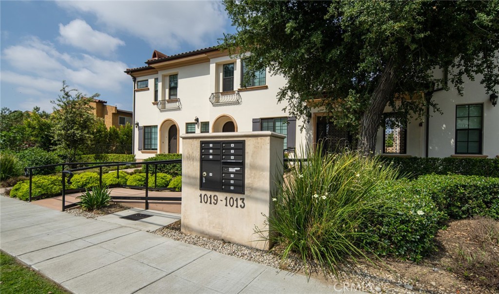 1019 Holly Avenue, Unit A Arcadia, CA 91007 - Photo 4 of 40 a view of a white house with large windows and plants