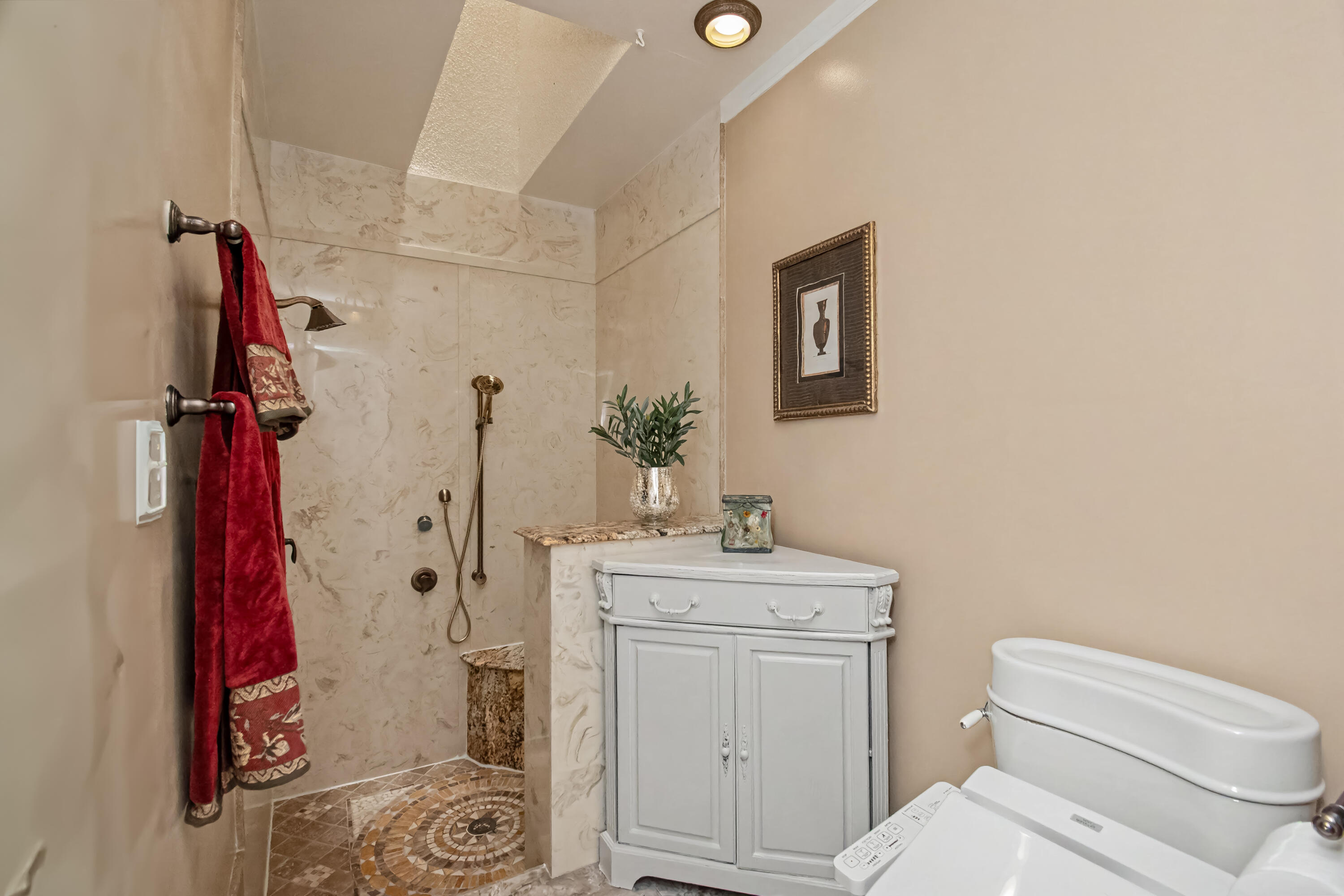 9708 Erica Court Boca Raton, FL 33496 - Photo 32 of 54 a bathroom with a toilet sink and vanity